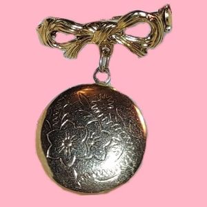 Bow Brooch with Dangling Round Gold Floral Locket